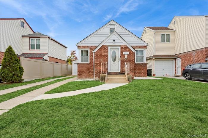 View of front of property with brick siding