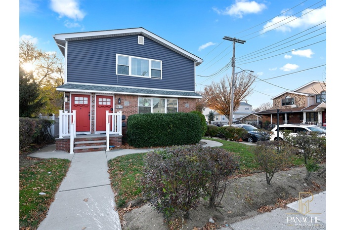 Traditional-style home with brick siding