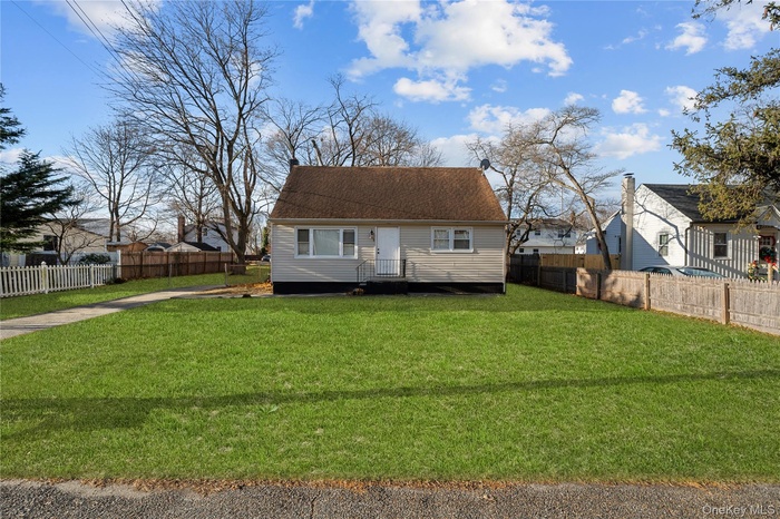 View of front of property with roof with shingles