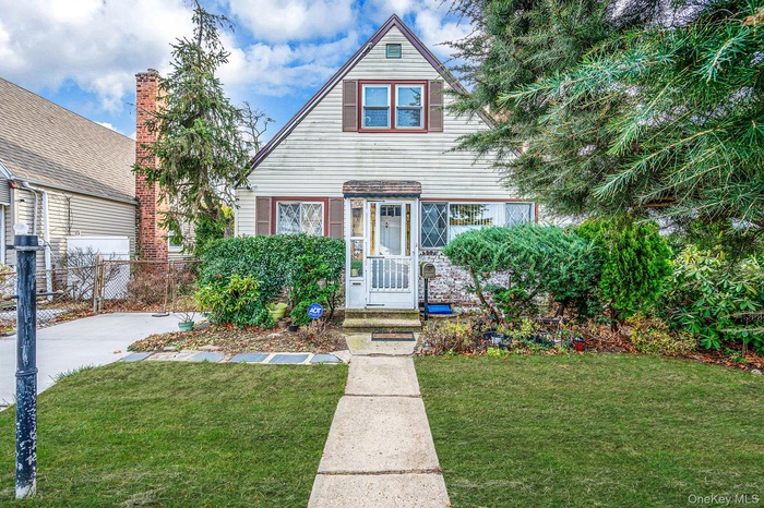 View of front of property featuring a front lawn