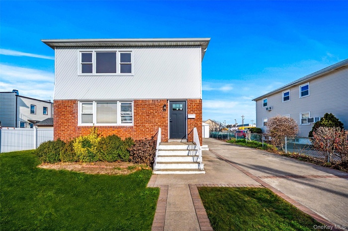 View of front of property with brick siding
