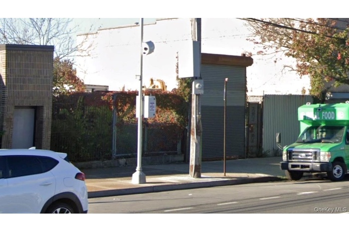 View of asphalt road featuring curbs