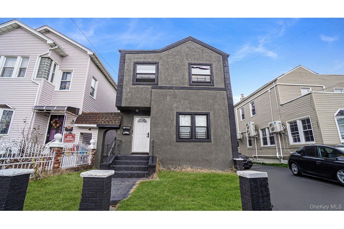 View of front facade with stucco siding
