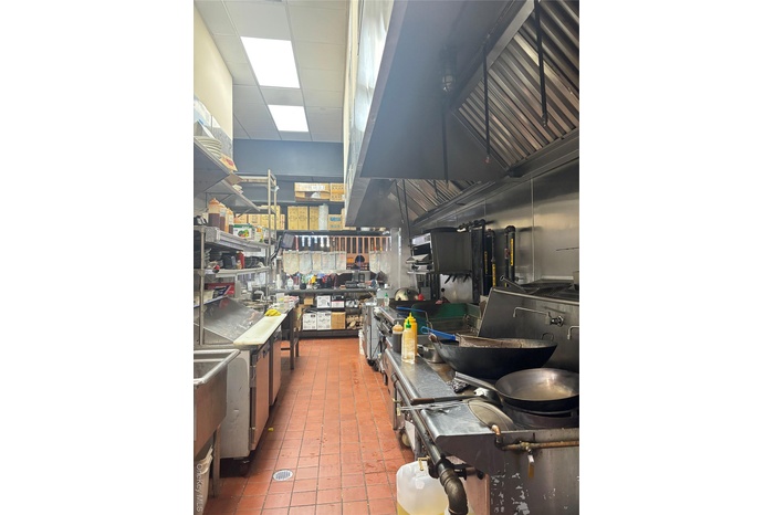 Kitchen with a drop ceiling and a sink