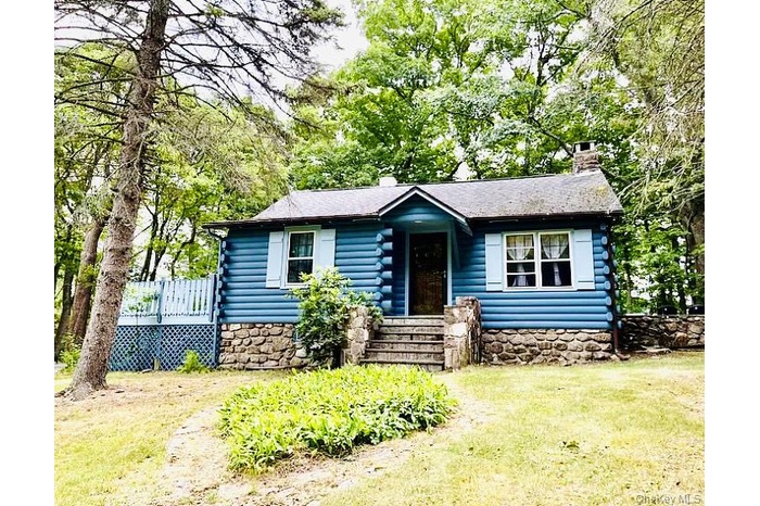 Welcome to 15 Locust Dr, a peaceful retreat in the Lake Valhalla community.