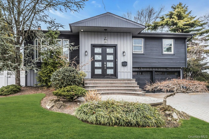 View of exterior entry featuring a garage