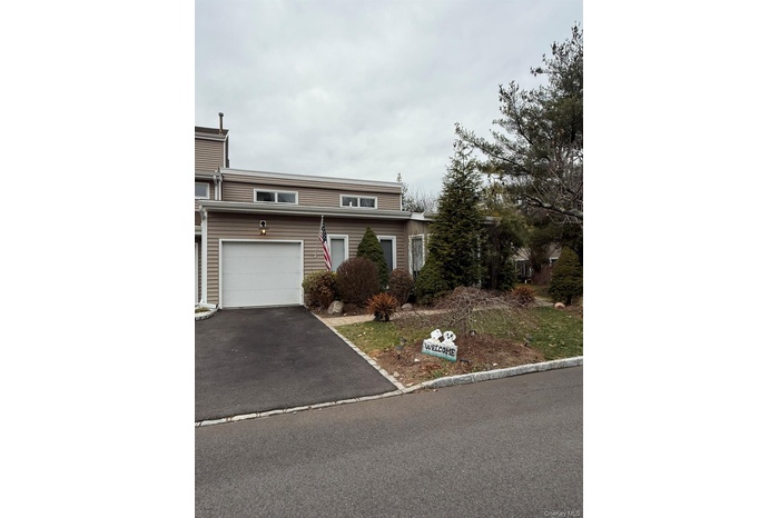 View of front of house featuring driveway and a garage