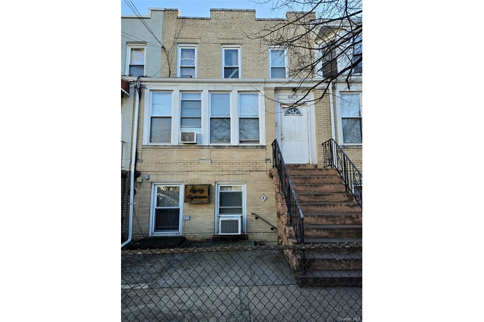 View of exterior entry with brick siding
