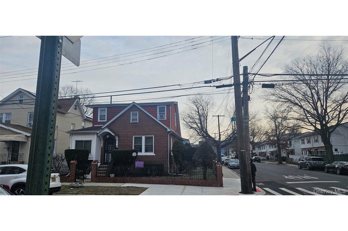 View of front of house featuring a residential view and brick siding