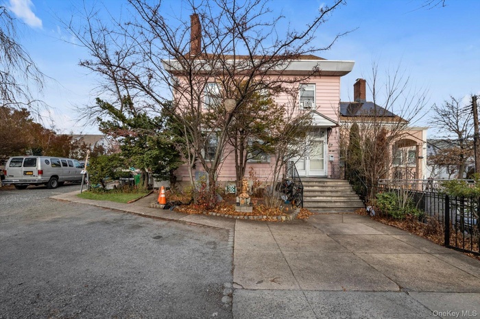 View of front of property featuring a chimney
