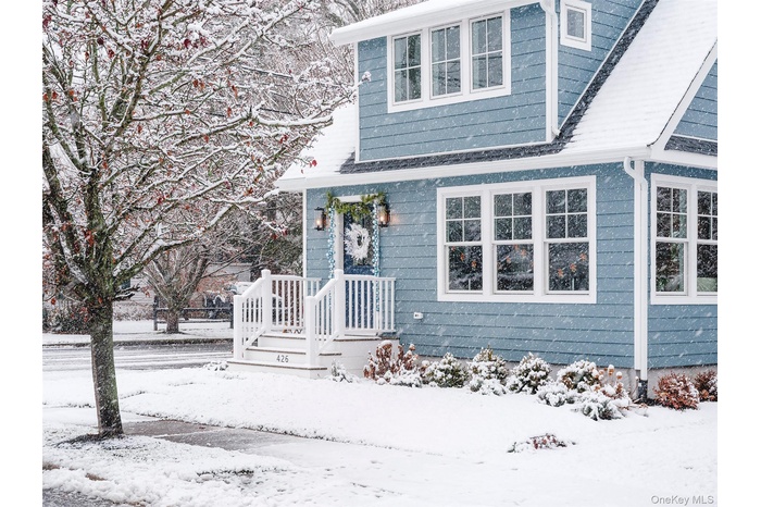 Snow cover brings out the charm of this newly renovated home.