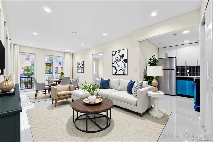 Living room with recessed lighting and light tile patterned flooring