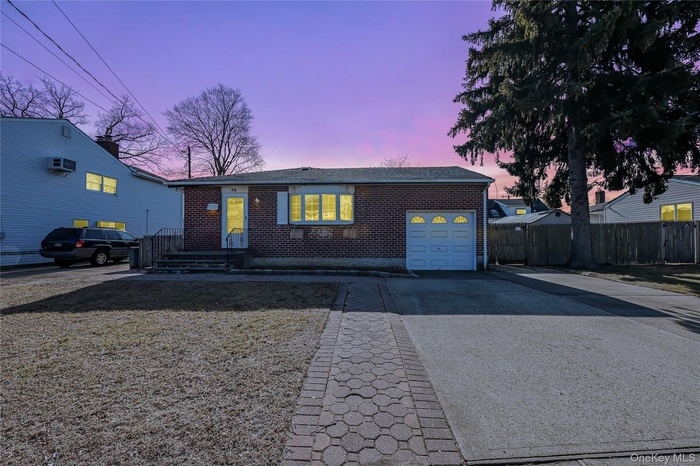 View of front facade featuring a garage