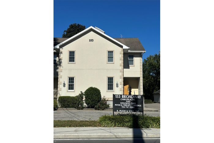 View of side of property featuring stucco siding