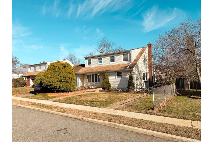 Traditional home with a chimney and a porch