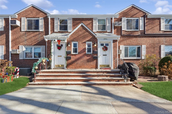 Traditional-style home featuring brick siding