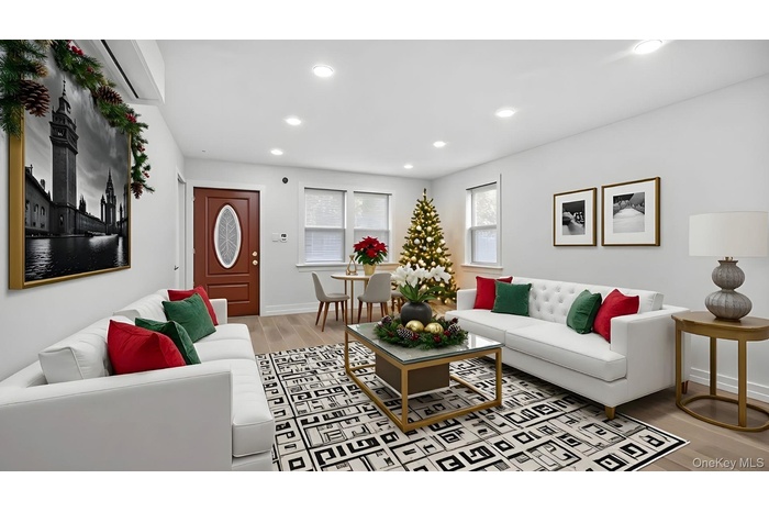 Living area featuring light wood-type flooring and recessed lighting