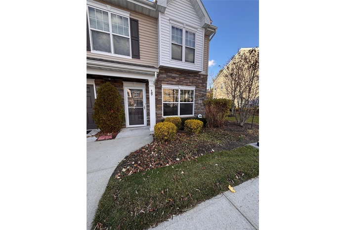 View of exterior entry with stone siding