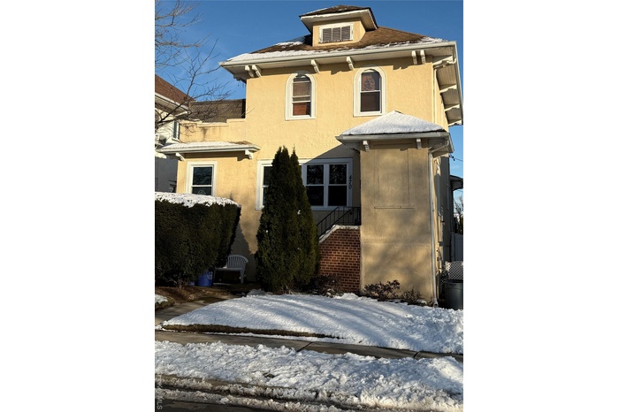 View of front facade with stucco siding
