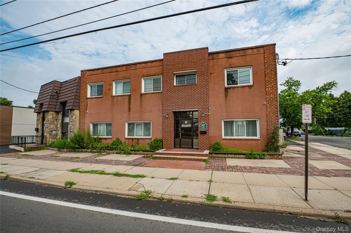 View of front of home featuring stucco siding