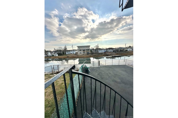 Water view with nearby suburban area