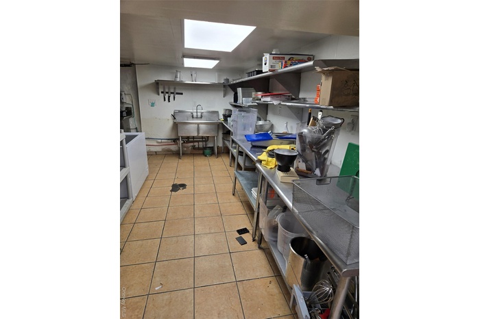 Kitchen featuring a skylight and washer / clothes dryer