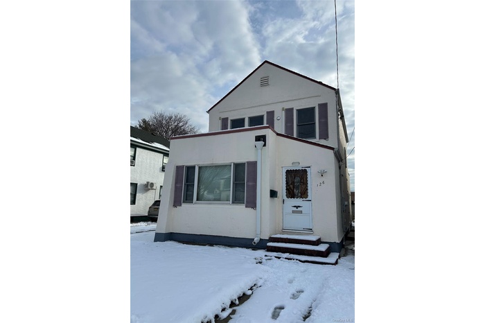 View of front of house featuring stucco siding