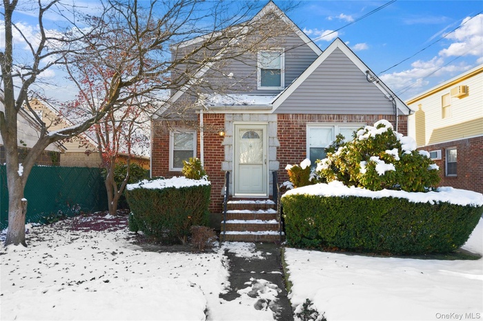 Bungalow-style house featuring brick siding