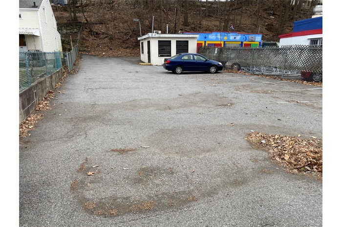 View of parking lot which is all fenced in
