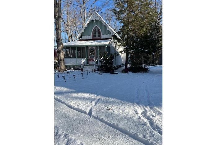 View of front of home with covered porch and board and batten siding