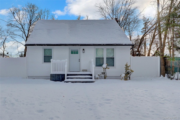 View of front of property featuring a chimney