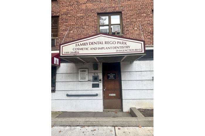 Doorway to property with brick siding