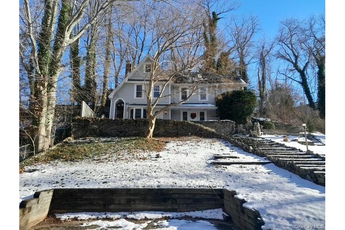 View of front of property with a chimney