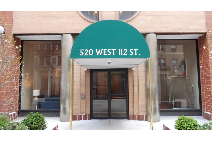 Entrance to property featuring brick siding and french doors