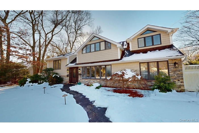 View of front facade with stone siding