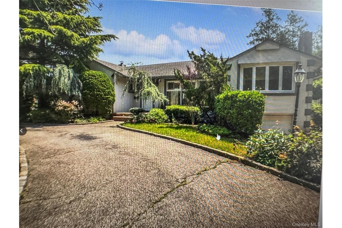 View of front of home featuring a chimney