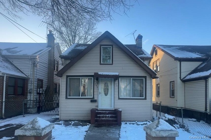 View of front facade featuring a fire pit