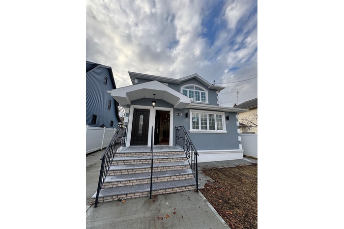 View of front of house with stucco siding
