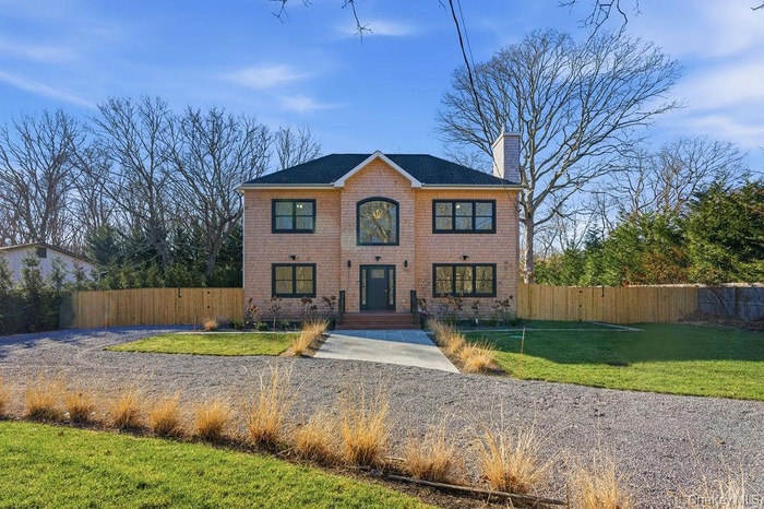 View of front of property with a chimney