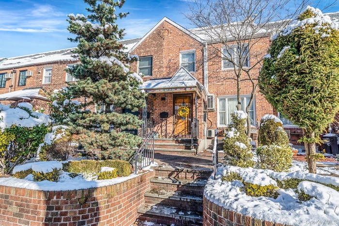 Traditional home with brick siding