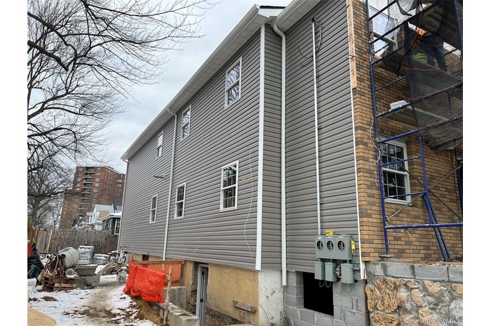 View of property exterior featuring a patio area