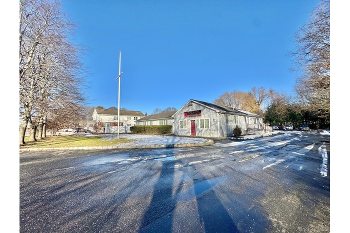 View of asphalt road with a residential view