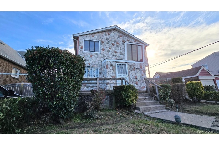 View of front facade with stone siding