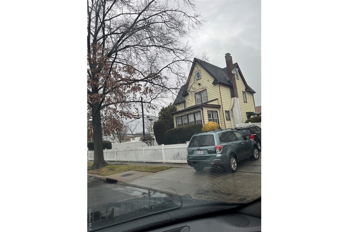 View of side of home with a chimney