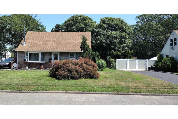 View of front of home featuring a shingled roof