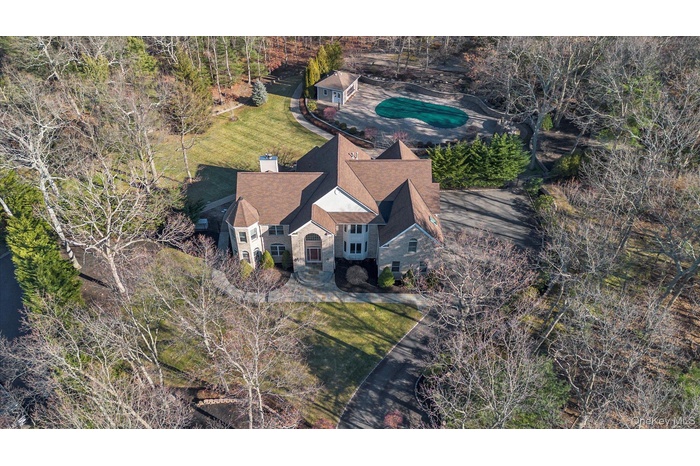 View of subject property featuring a pool area