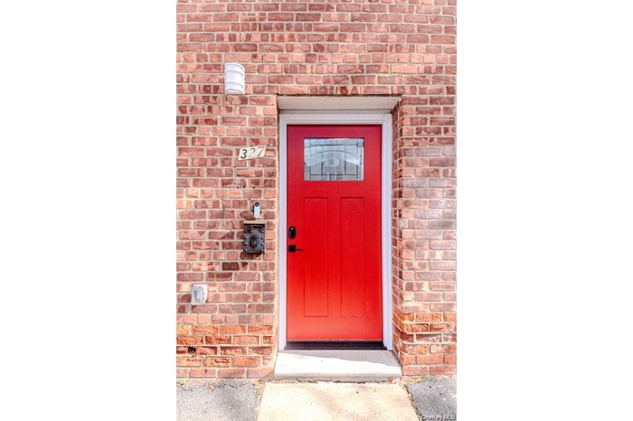 Entrance to property with brick siding