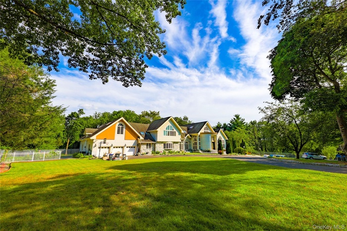 Craftsman inspired home featuring stone siding and view of scattered trees