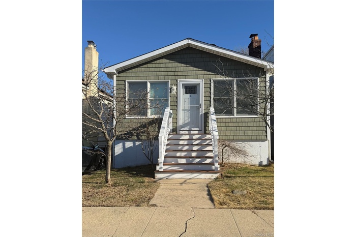 View of front facade with a chimney