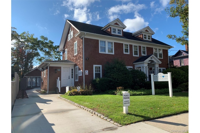 View of front of house with a front yard
